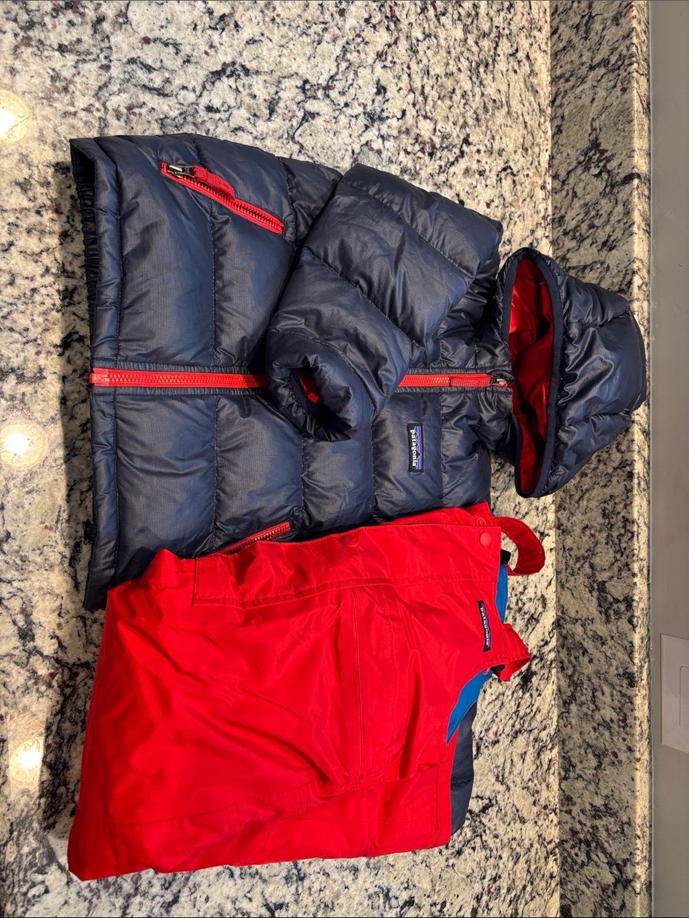 Patagonia Navy Puffy Jacket with Red Trim and Red Bib Snow Pants